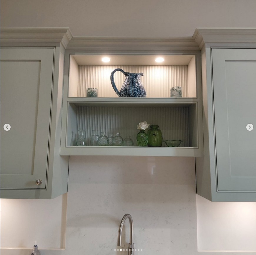 Bespoke kitchen with display shelving and detailed cabinetry
