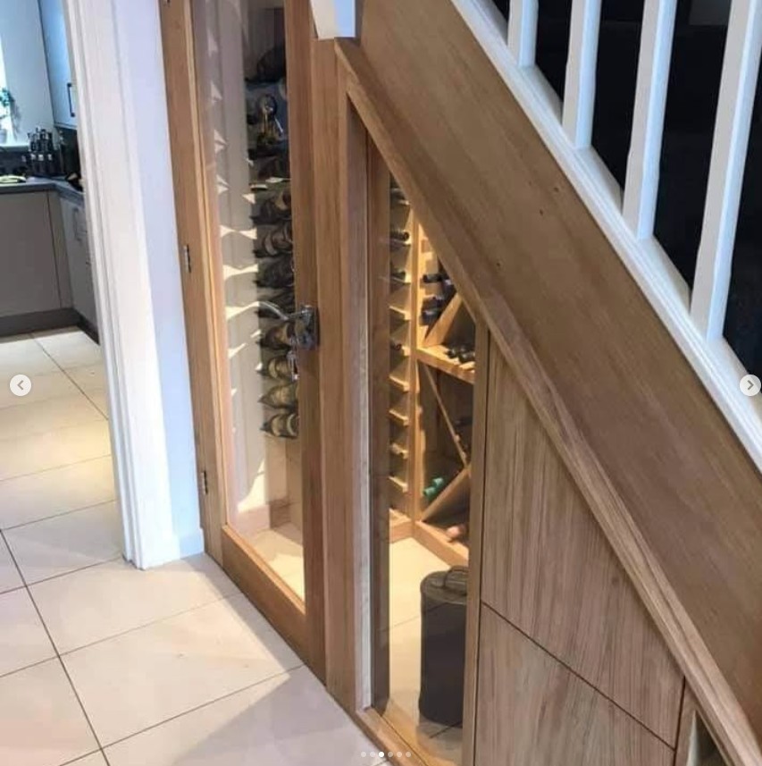 Under stairs wine storage with glass-fronted display and integrated LED lighting
