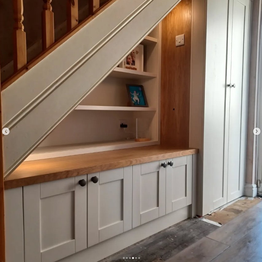 Under stairs storage with open display shelving, solid oak worktop and shaker cupboards